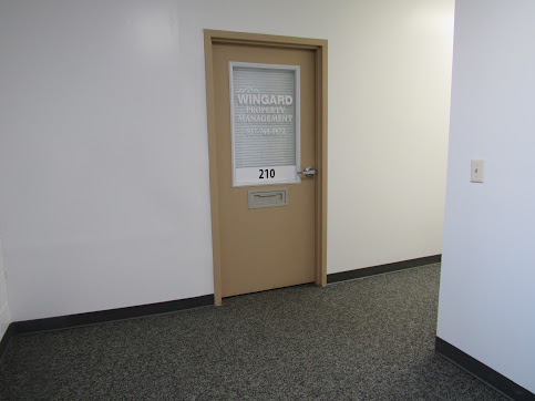 Wingard Property Management office door, Suite 210